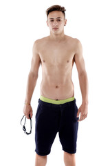 Fototapeta premium Portrait of a young man with swimming goggles on white backgroun