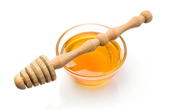 Honey with wooden dipper