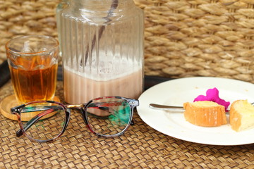 Glasses with bread and tea with ice chocolate