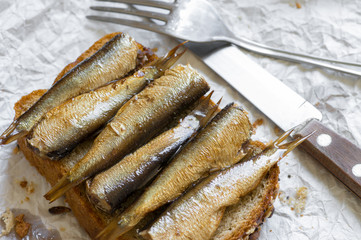 Sandwich with sprats in a rustic style