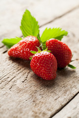 Delicious fresh strawberries on wooden background