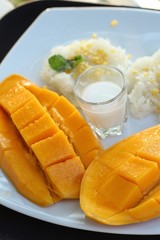 sticky rice with coconut milk mix and ripe mango.