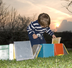 Little boy with a small beehive