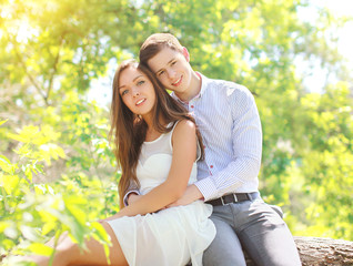 Happy young couple together in sunny summer day