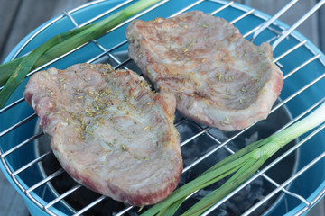 Pork cutlets on barbeque.