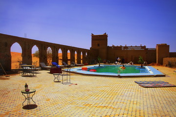 l moment of relaxation in a hotel swimming pool amids moroccan d