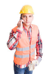 Professional and modern builder using smartphone