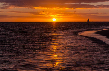 Beautiful sunset on a sandy beach in Mauritius