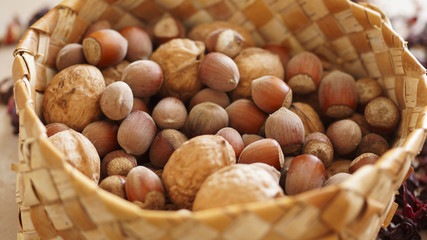 a basket of walnuts and hazelnuts
