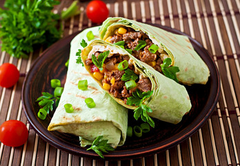 Burritos wraps with minced beef and vegetables 