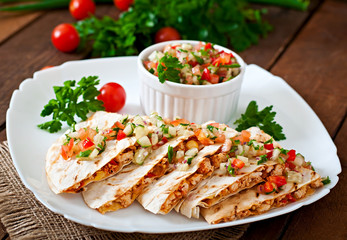 Mexican Quesadilla wrap with chicken, corn and salsa