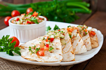 Mexican Quesadilla wrap with chicken, corn and salsa