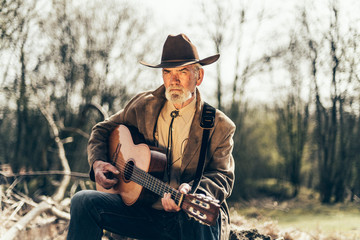Senior man playing country music