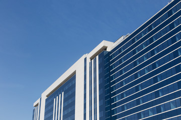 Fototapeta na wymiar glass building on a sky background