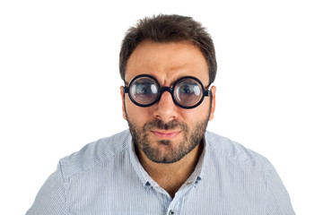 Man with a surprised expression and thick glasses