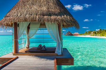 Fototapeta premium Romantic and luxurious overwater spa with tropical lagoon view