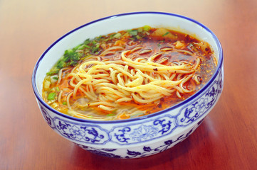 Chinese Lanzhou noodles, in a porcelain bowl.