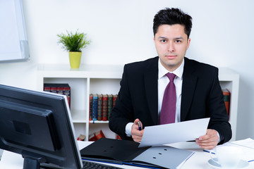 attractive business man in office