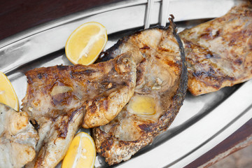Grilled tuna fish on silver plate