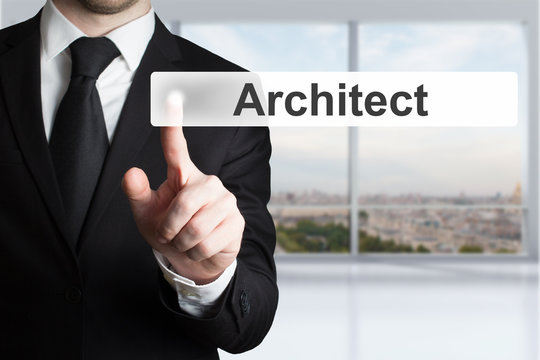 businessman in office pushing button architect