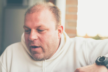 Obraz premium Serious man with downcast eyes