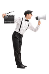 Obraz premium Young movie director shouting on a megaphone