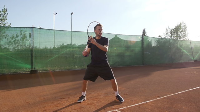 Slow Motion Of Professional Tennis Player Hitting The Ball With Tennis Racket