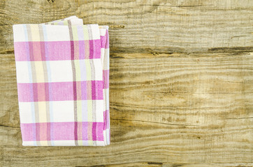 Violet towel over white wooden table