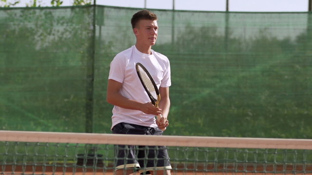 Slow Motion Of Young Tennis Player Practicing Backhand