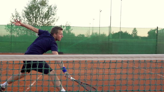 Slow Motion Of Professional Tennis Player Hitting The Ball With Backhand Stroke