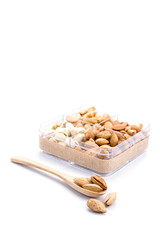Assorted nuts in wooden spoon