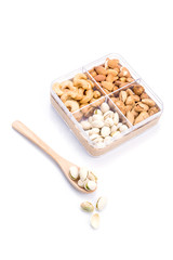 Assorted nuts in wooden spoon