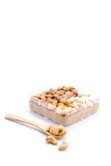 Assorted nuts in wooden spoon