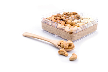 Assorted nuts in wooden spoon
