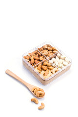 Assorted nuts in wooden spoon