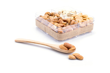 Assorted nuts in wooden spoon