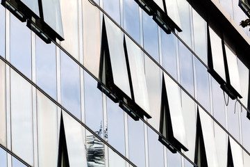 Fototapeta na wymiar glass facade with opened windows