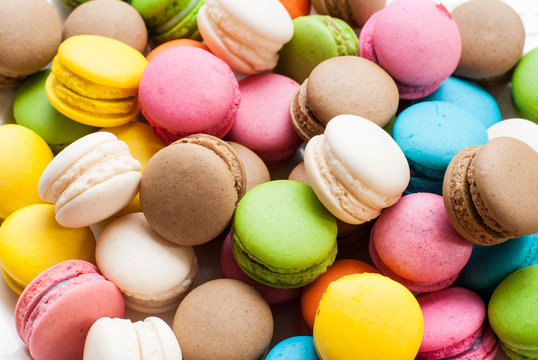 traditional french colorful macarons in a box, background
