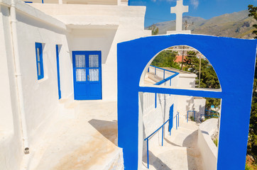 A view of a Greek church with iconic blue colors on Greek island