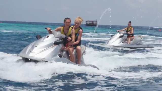 Best Friends Enjoy The Jet Ski Ride