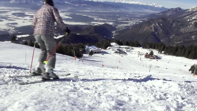Slow Motion Of A Skier Skiing Down The Ski Slope With Spectacular Mountain View