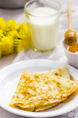 Summer rural breakfast pancakes with honey and milk