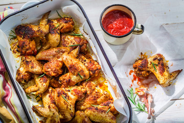 Crispy chicken wings with herbs and sauce