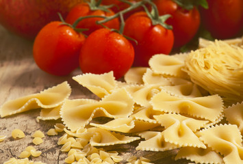 Variety of pasta on a wooden table, selective focus