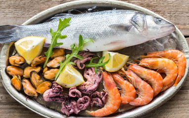 Fresh seabass with seafood on the tray