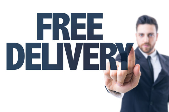 Business man pointing the text: Free Delivery