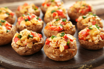 Stuffed mushrooms on cutting board