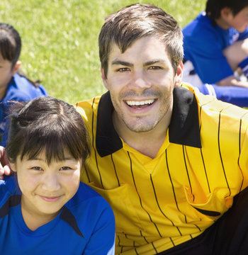 Portrait Of Asian Girl And Soccer Coach