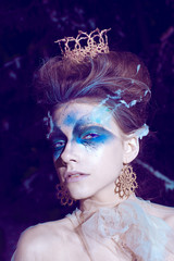 blue make up with  hairdress and  crown on  head