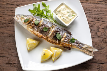 Grilled seabass on the wooden board